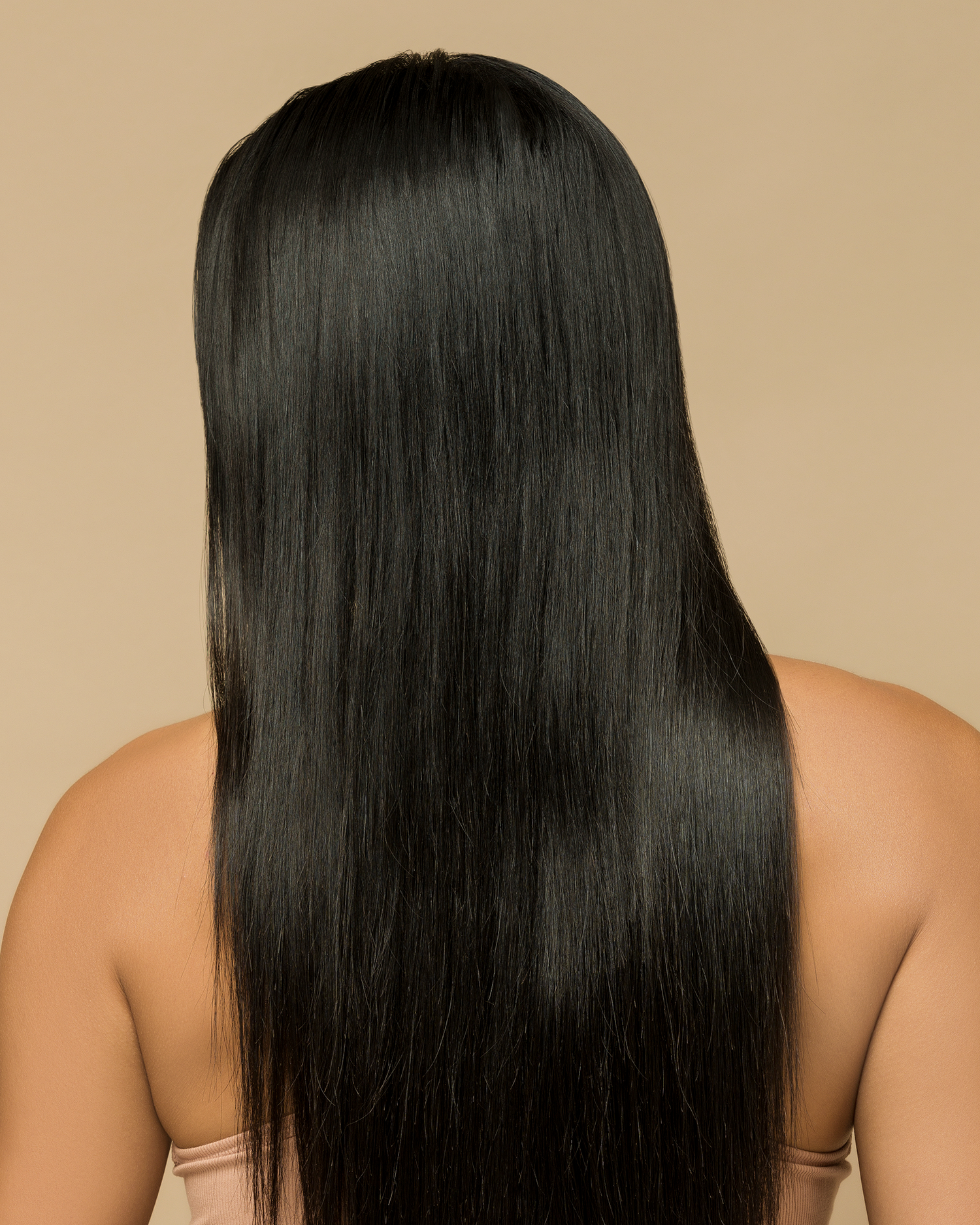 Back of woman's head, showing off long black hair