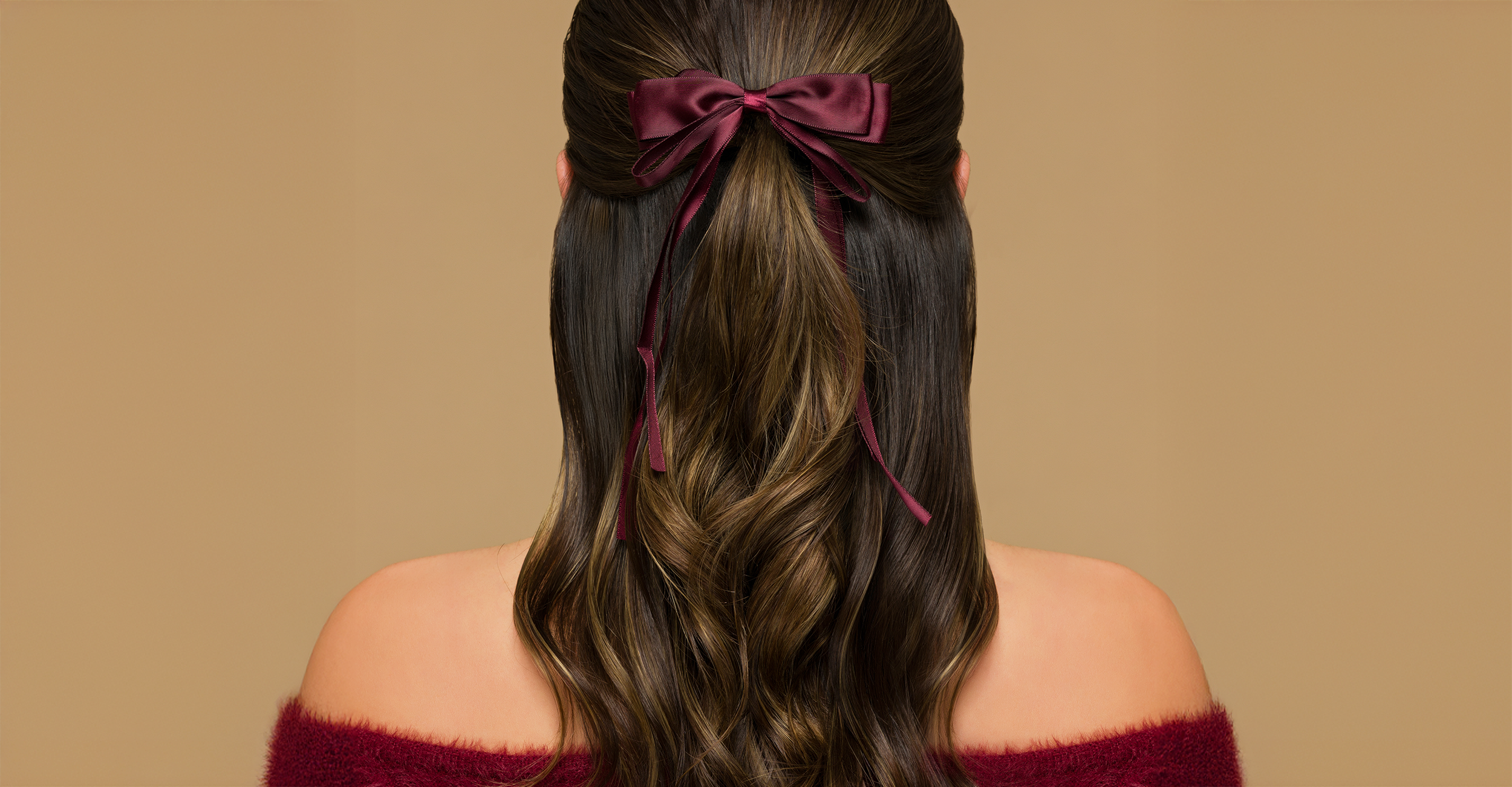 Woman with brunette hair with a hair bow 