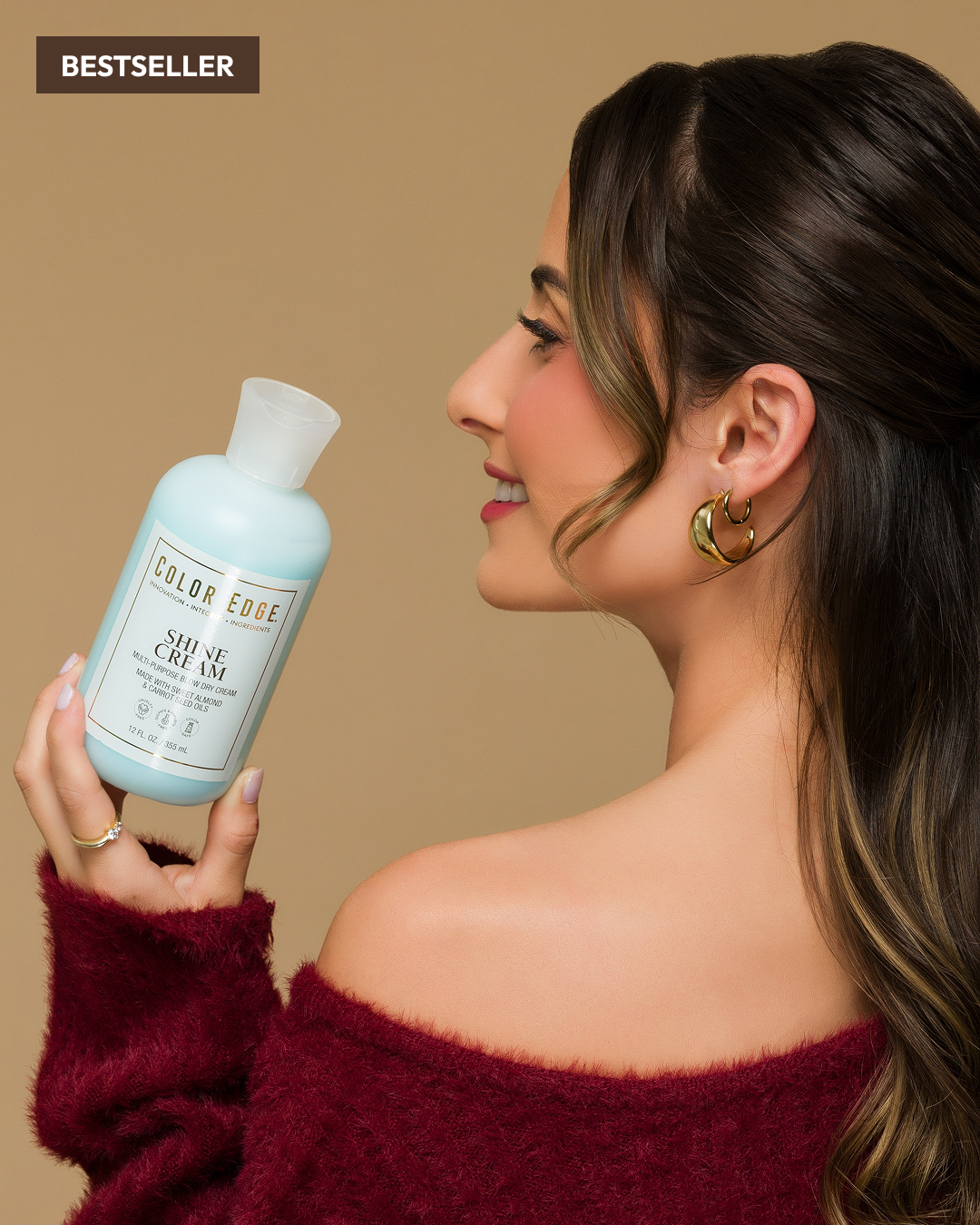 Woman holding Shine Cream bottle