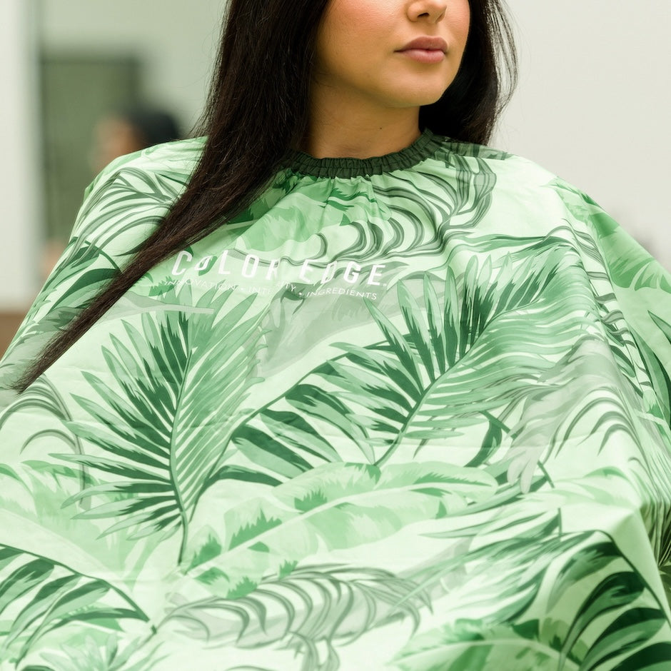 Client wearing green palms Cali Collection Chemical Cape