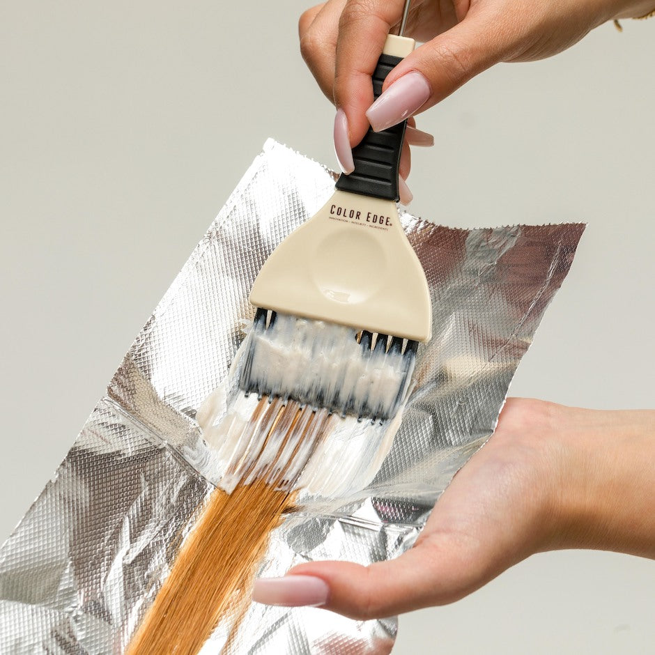 Applying bleach to hair using Rake Tint Brush