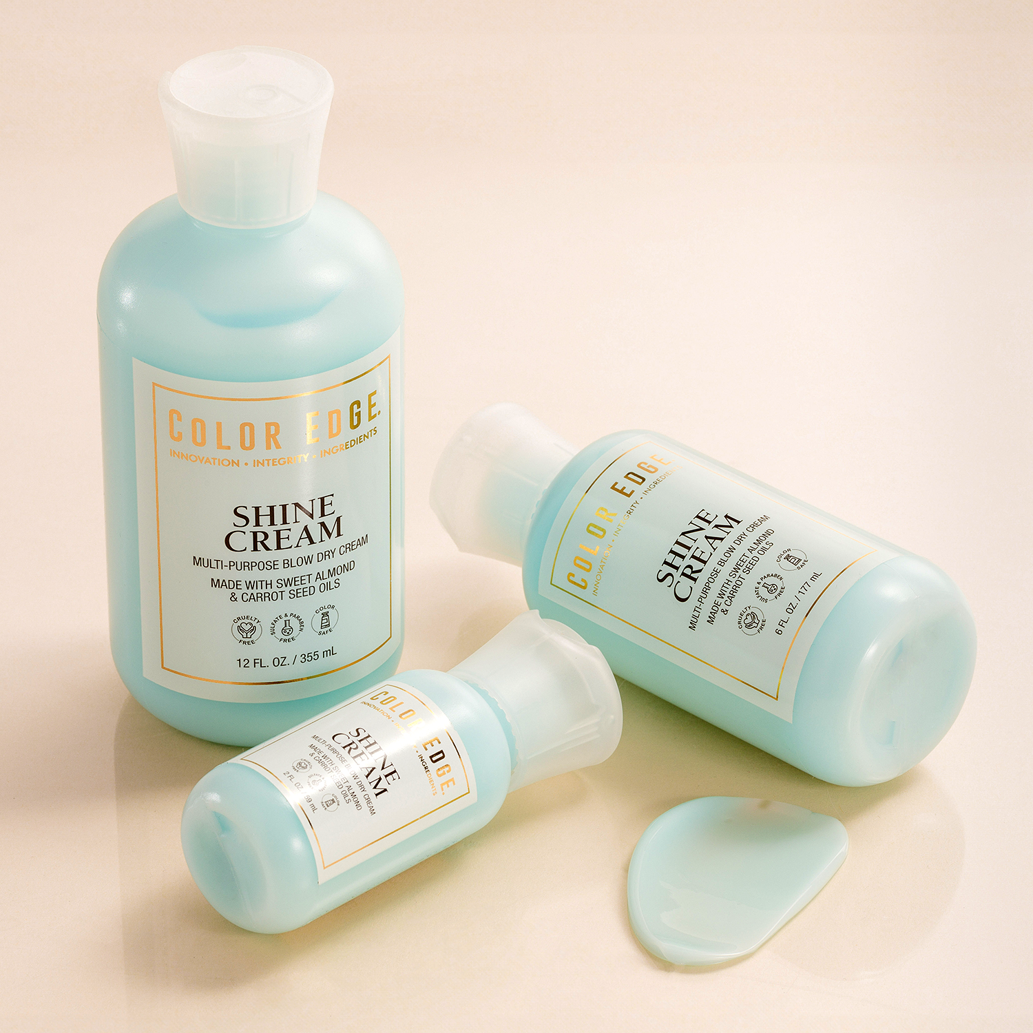 Three bottles of Color Code Shine Cream on a beige background