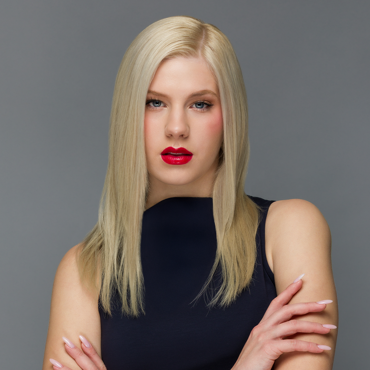 Model with platinum blonde hair and red lips