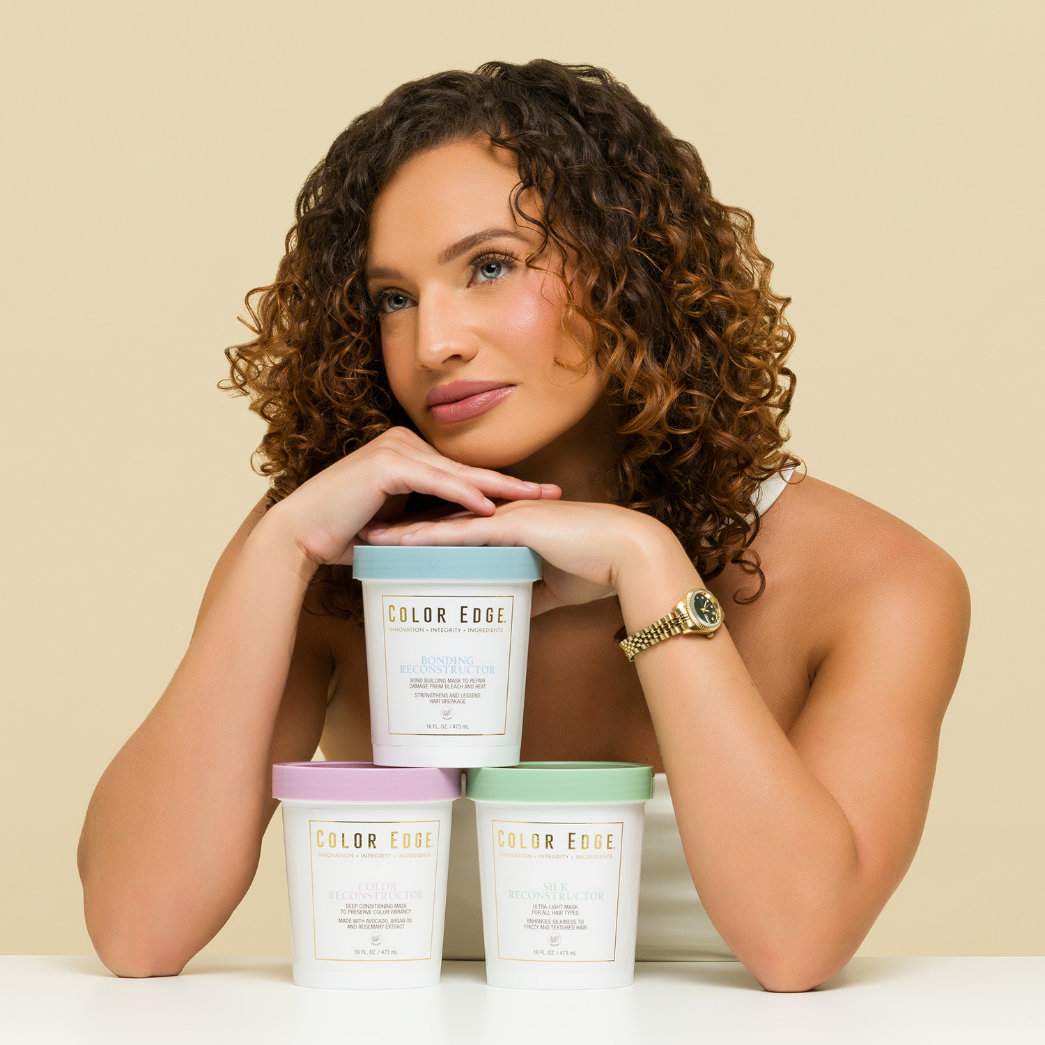 Woman with 3 tubs of Color Edge Reconstructors