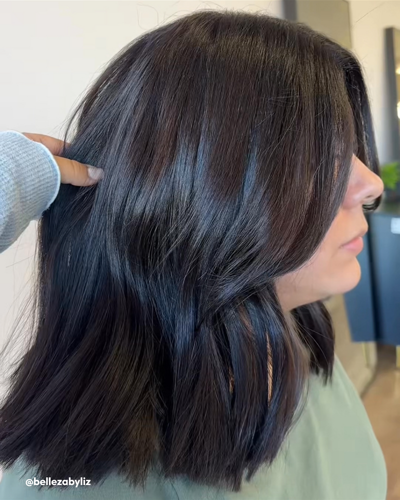 Women with Silk Reconstructor, Shine Cream, and Polish in hair