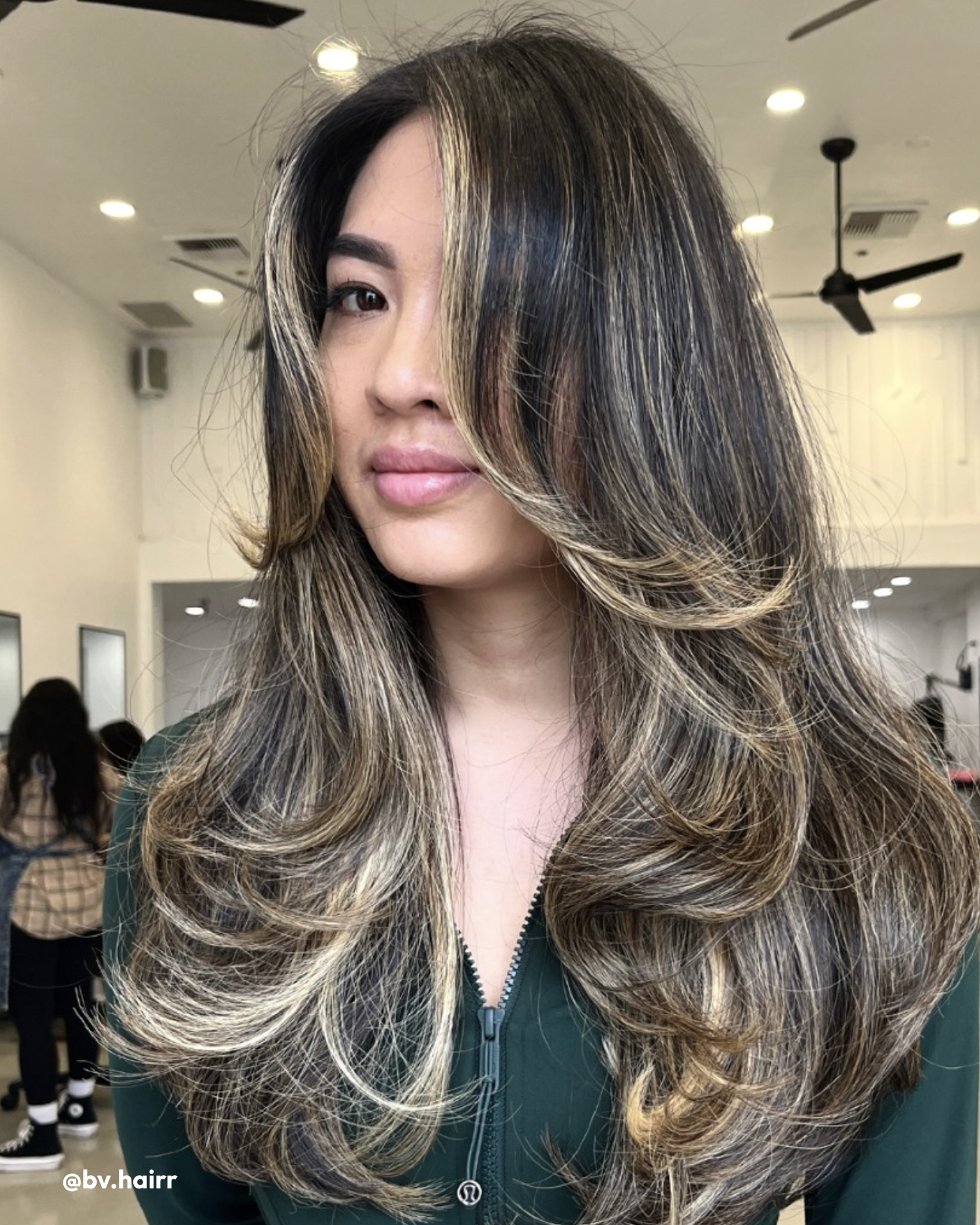 Women with Silk Reconstructor, Styling Foam, and Camellia Oil in hair